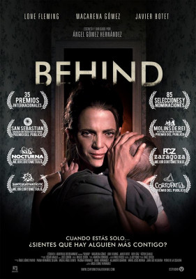 Behind poster